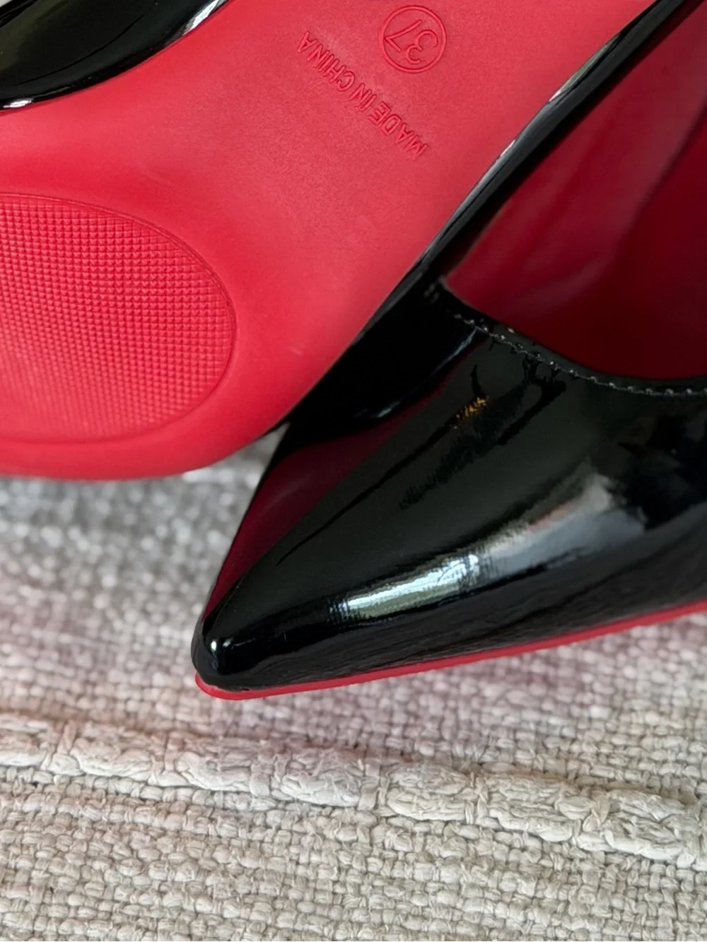 Black Patent Pointed-Toe Pumps with Red Soles